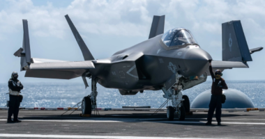 F-35 fighter jet on an aircraft carrier.
