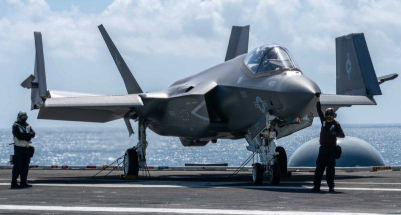 F-35 fighter jet on an aircraft carrier.