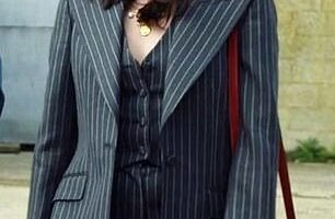 Susie Glass¿s pinstriped three-piece grey suit is Dolce & Gabbana: jacket, £1,800; trousers, £725; and waistcoat £525