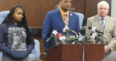Mayor Marty Smalls Sr. speaks at a press conference on Monday to address the search of his home and cars as his daughter Jada Smalls and his attorney, Edwin Jacbos (pictured right), stand next to him