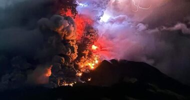 Australia is on tsunami alert after Indonesian stratovolcano Mount Ruang (pictured), in North Sulawesi Province, erupted spectacularly five times in 24 hours