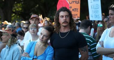 Abbie Chatfield and Adam Hyde were seen at the 'No More' protests in Sydney on Saturday