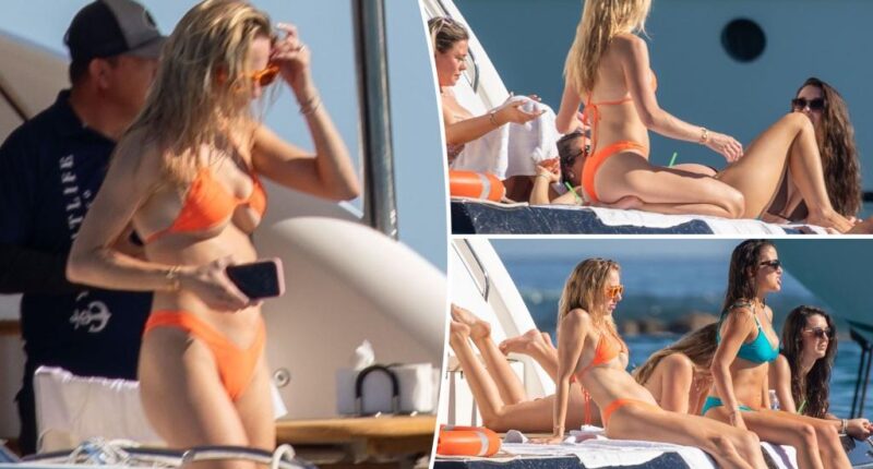 Brittany Mahomes sports tiny orange bikini on boat trip with her gal pals