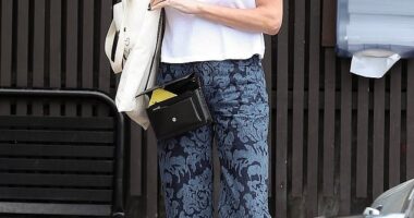 Charlize Theron cut a casual figure while leaving a sushi spot with friends in Los Angeles on Friday afternoon