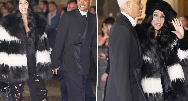 Cher, 77, and boyfriend Alexander 'AE' Edwards, 38, pack on the PDA at Dolce & Gabbana event in Milan