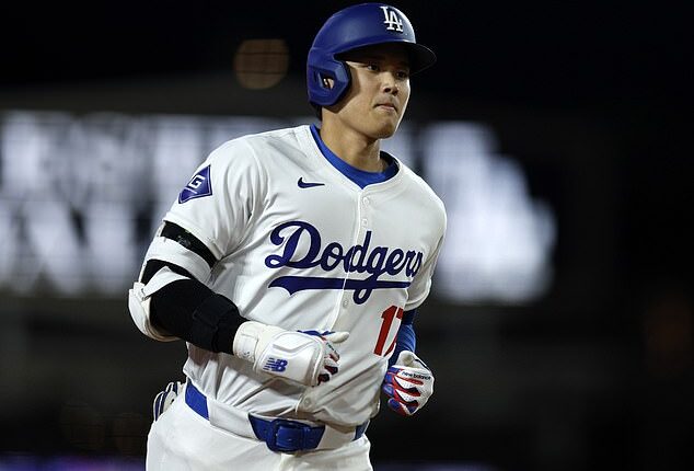 A lifelong LA Dodgers fan who caught Shohei Ohtani's first home-run ball for the team claims she was pressured into handing the $100,000 item back to him