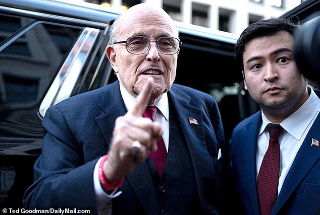 Giuliani spokesperson Ted Goodman, right, insists the embattled mayor and former Trump attorney, left, has no regrets about working to overturn the Arizona election results in 2020, despite being indicted by a grand jury on Wednesday