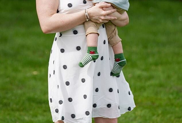 Amee Gleadell from Lincoln says other mothers shame her for being 'naturally pretty'. Pictured with her son Arthane, 15 months