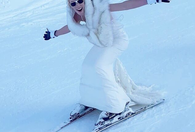 Laura Norcott, from Mere, in Cheshire, took her entire wedding party to the top of a 2,600-metre snowy mountain to say 'I do' - before racing the 4km back down in her dress