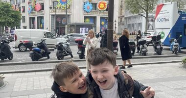 Brody, 11, (right) and Romeo, 7, (left) are all smiles in Paris to celebrate their mother's big 40th birthday