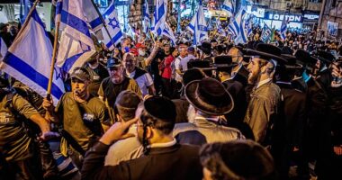 Israel has been rocked by a second night of protests after huge crowds descended on the streets of Jerusalem (pictured: ultra-orthodox protesters in Mea Shearim)