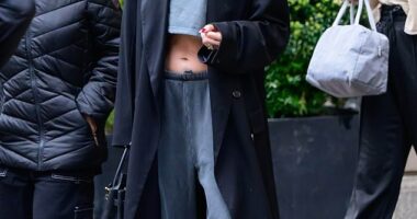 Jennifer Lopez showed off her enviable abs in a tiny grey crop top and a pair of low-rise sweatpants while stepping out of her luxurious New York City penthouse