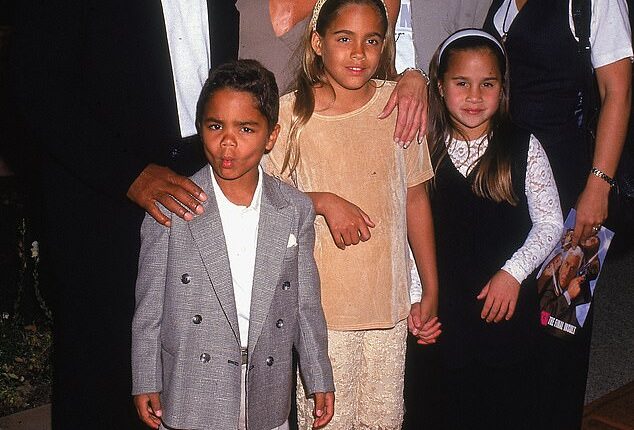 OJ Simpson pictured with his ex-wife Nicole and their blended family at the premiere of Naked Gun 33 1/3 in 1994, just three months before her murder