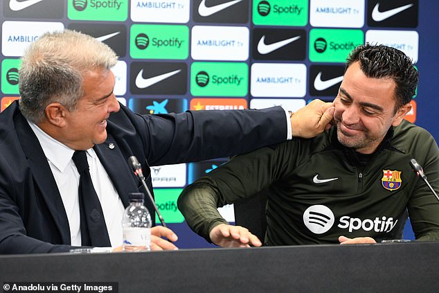 Barcelona president Joan Laporta (left) said today that Xavi (right) would be staying at the club