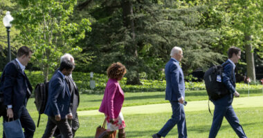 Report: Joe Biden, 81, Walks with Aides to Marine One to 'Draw Less Attention' to Awkward Stride  
