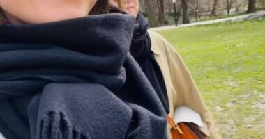 Finland 's former Prime Minister Sanna Marin has shared selfies of her recent trip to New York (pictured: Sanna walks through Central Park with a friend)