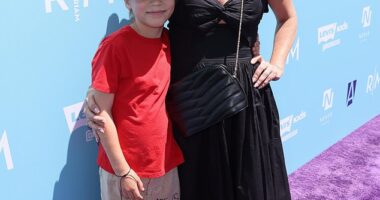 Tiffani Thiessen showed off her trendy style while out with her son Holt, 8, at the P.S. ARTS Express Yourself Event in Los Angeles on Sunday