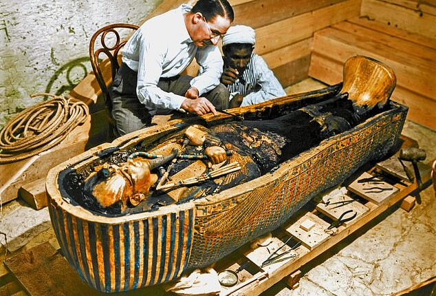 A scientist claims to have cracked the case of the 'Pharaoh's curse' that was believed to have killed more than 20 people who opened King Tutankhamun's tomb in 1922. Pictured is Howard Carter who was long said to die from the curse