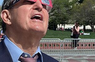 Sen. Joe Manchin, D-W.V., watches the 2024 solar eclipse