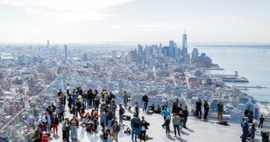 People gather on 'The Edge' observation deck ahead of a total solar eclipse across North America, in New York City on April 8, 2024