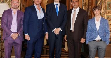 Barron Trump is his father's doppelganger in a new picture showing the 6'7" teen towering over guests (L-R) Colby Covington, Justin Waller, Patrick Bet-David and Bo Loudon