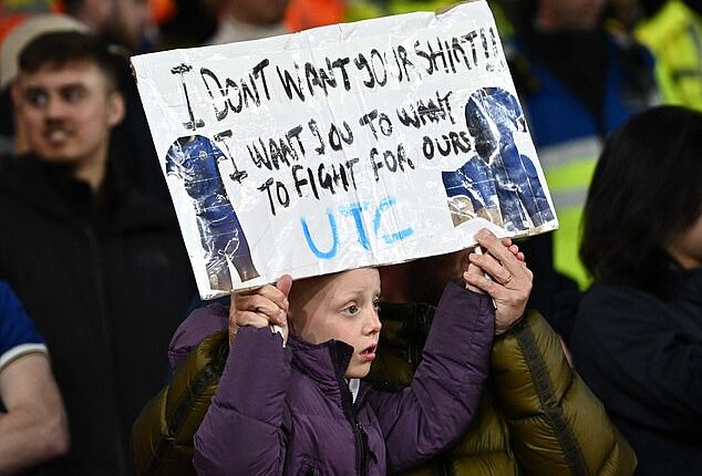 A young Chelsea fan held up a sign telling players he didn't want their shirts and instead told them to fight for the kit - a damning assessment during a heavy 5-0 loss to Arsenal
