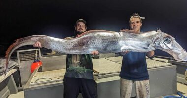 Curtis Peterson, from Tiwi Islands Adventures, and a young angler with their rare catch.