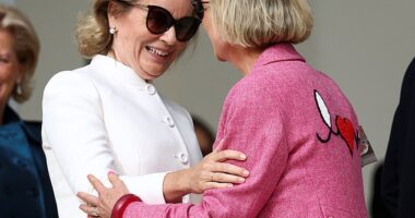 Queen Mathilde of Belgium (pictured left) was joined by Princess Delphine (right) today as the two attending Sunday mass directed by Pope Francis
