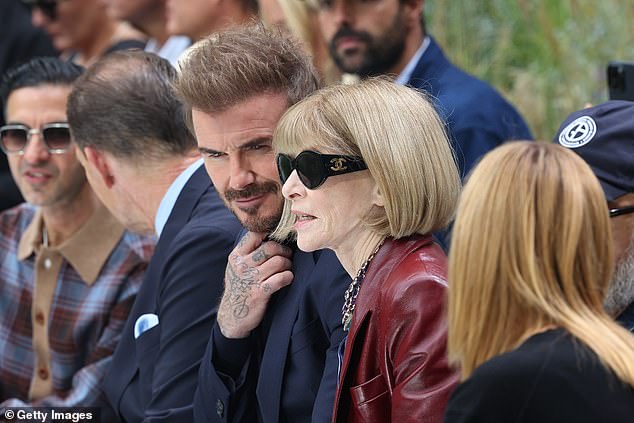 David Beckham looked dapper as he joined fashion icon pal Anna Wintour on the front row at the BOSS show during Milan Fashion Week on Wednesday
