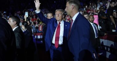 Donald Trump surrounded by his Secret Service detail at an event in Michigan on Tuesday