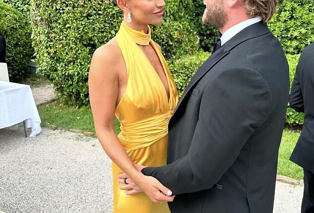 Ferne McCann, 34, stunned in a plunging mustard gown as she and her fiancé Lorri Haines, 33, put on a loved-up display at a friend's wedding on Sunday