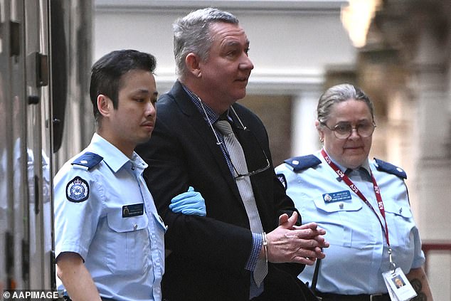 Former pilot Greg Lynn enters the Supreme Court of Victoria on Thursday in chains
