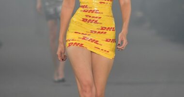 Gigi Hadid, 29, proved she really is the whole package as she shipped fashion to new heights in a mini dress made from DHL parcel tape for the Vetements catwalk during Paris Fashion Week