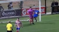The Cove FC goalkeeper Ryan Veitch dropped a shoulder into Modbury Vista's Dimos Karagiannis