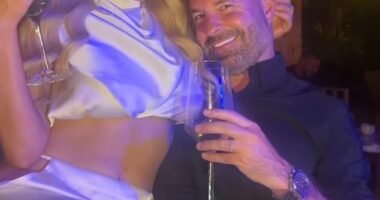 Helen Flanagan put on a very daring display as she ditched her underwear in a racy cut-out satin skirt - before sitting on her boyfriend Robbie Talbot's lap - in a TikTok video on Sunday