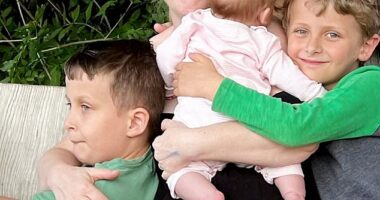 Beth Hobson, 55, from Manchester, began IVF fifteen years ago despite being told she only had a 10 per cent chance at conceiving naturally - pictured with her three children