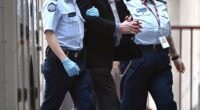 Greg Lynn enters the Supreme Court of Victoria in handcuffs on Wednesday. He faces life behind bars for the murder of Carol Clay