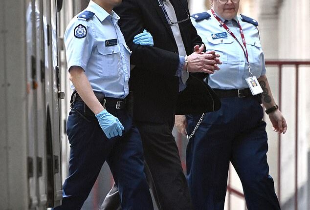 Greg Lynn enters the Supreme Court of Victoria in handcuffs on Wednesday. He faces life behind bars for the murder of Carol Clay