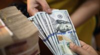 Investors clinging to cash face these two risks as the Fed cuts interest rates, researchers say