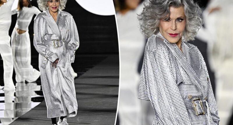 Jane Fonda struts her stuff for L'Oréal Paris runway in sparkling trench coat and sneakers