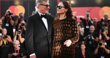 Joaquin Phoenix looked lovingly at his sister Rain as she supported him on the red carpet at the Joker: Folie à Deux premiere on Wednesday.