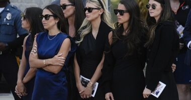 The wife of NHL star Johnny Gaudreau, Meredith (center) revealed that she is nine weeks pregnant with their third child during a tearful tribute at his funeral on Monday