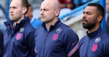 Interim head coach Lee Carsley (middle) has admitted he won't sing the England national anthem