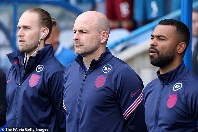 Interim head coach Lee Carsley (middle) has admitted he won't sing the England national anthem