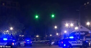 Mass shooting rocks major Alabama city as four killed and at least 22 injured in cigar lounge bloodbath