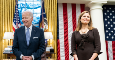 Joe Biden standing in Oval Office next to photo of Amy Coney Barrett standing in front of American flags