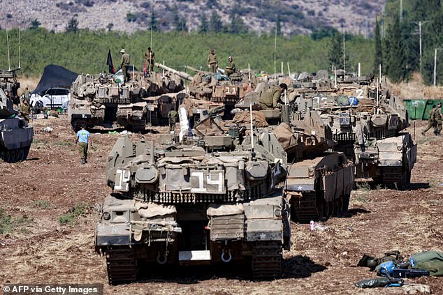 Hundreds of Israeli tanks have lined up at the Lebanon border, with a ground invasion looming