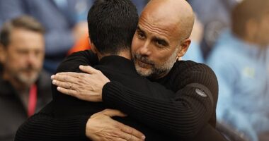 Managers Pep Guardiola (right) and Mikel Arteta pictured hugging before last Sunday's game