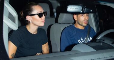 Miley Cyrus decided to wear her sunglasses as night as she was driven away by a pal from her boyfriend's concert in West Hollywood, CA Saturday