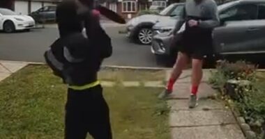 Footage shows a young man wearing black clothes pulling a massive knife out of a shaft and threatening another man